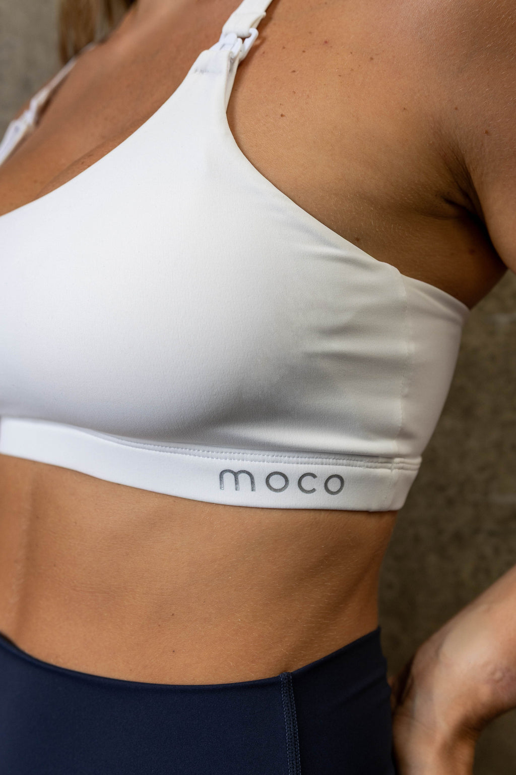 Mum wearing Moco Leisure Mum breastfeeding bra in Pure Calm - sleek fit medium high support removable cups breastfeeding activewear